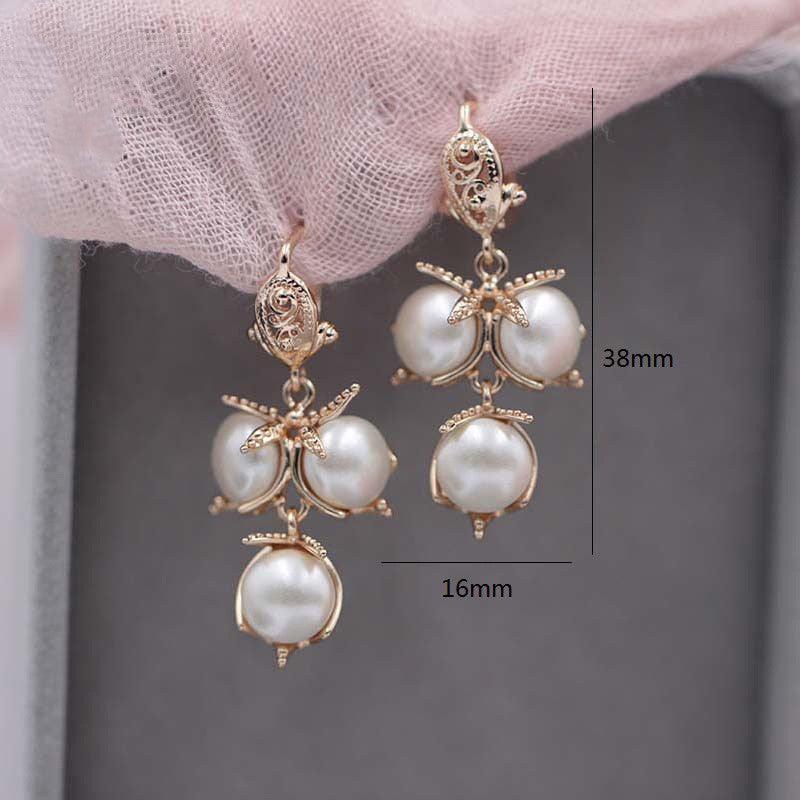 Ladies Flame Rose Gold Shell Pearl Earrings - Nioor